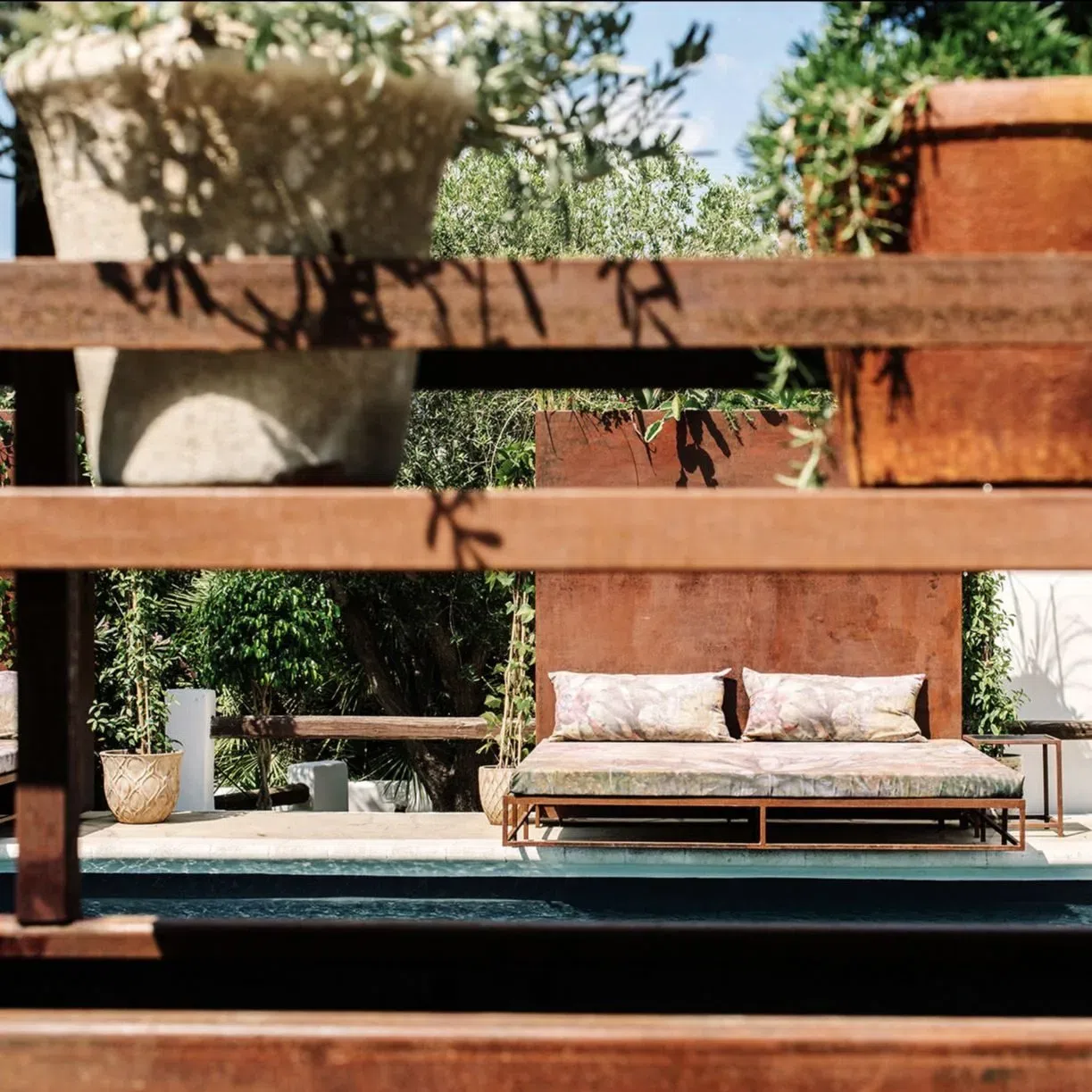 Rustic sun loungers at the Legado pool area