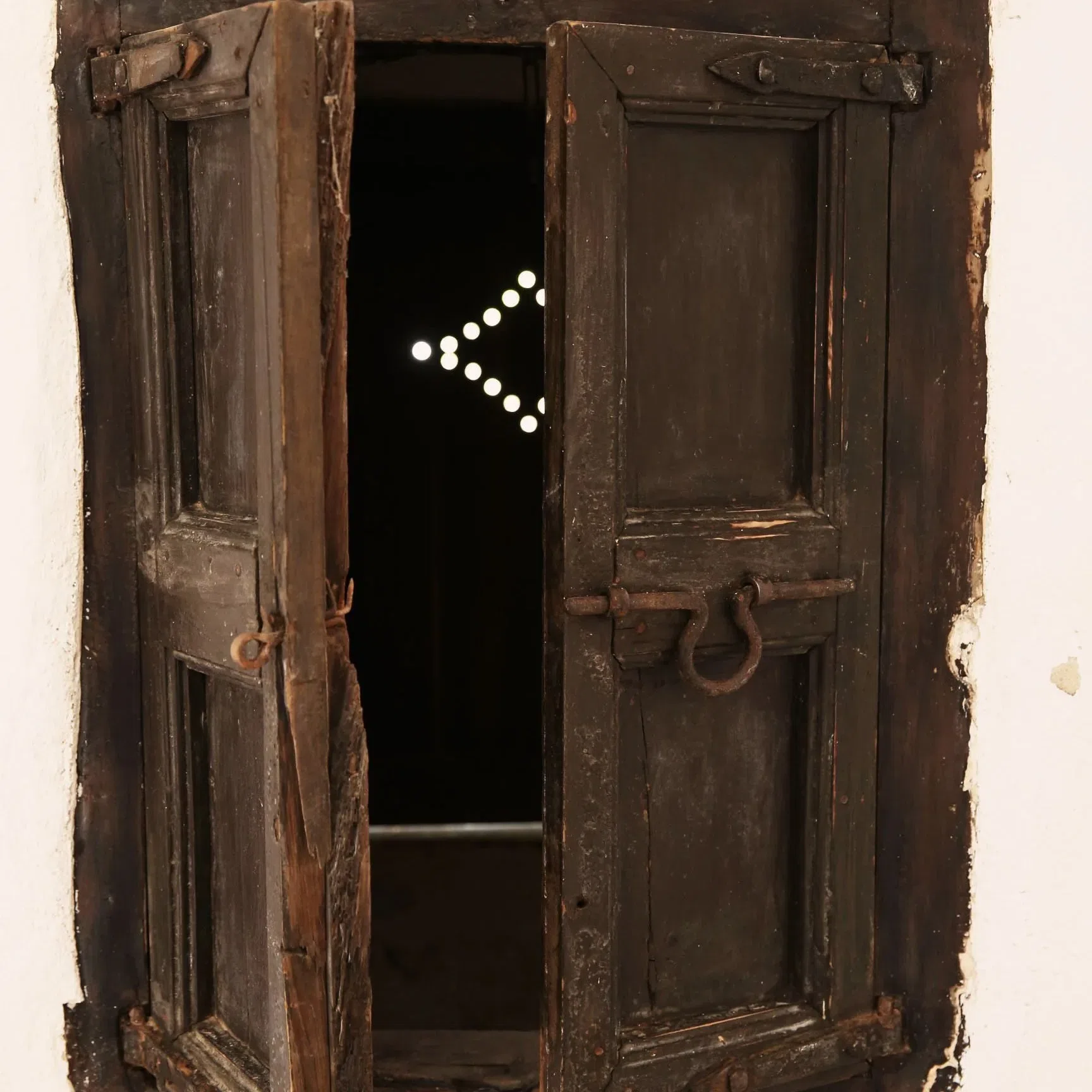 Rustic wooden shutters to the old Legado cistern